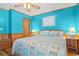 Bright bedroom featuring wood paneling, ceiling fan, and coastal decor at 9540 Shore Dr. # 3-H, Myrtle Beach, SC 29572