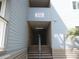 Condo entrance to Building 1 at 9540 Shore Drive with stairs and beachy vibes at 9540 Shore Dr. # 3-H, Myrtle Beach, SC 29572