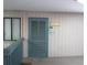 Cozy condo entryway with a blue door, 'Welcome' sign, and a colorful welcome mat at 9540 Shore Dr. # 3-H, Myrtle Beach, SC 29572