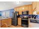 Contemporary kitchen equipped with stainless steel appliances and bar seating at 9540 Shore Dr. # 3-H, Myrtle Beach, SC 29572