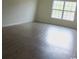 This room features light brown floors, white walls, and a large window that lets in plenty of light at 1411 Gooseneck Place # 202 Middle, Murrells Inlet, SC 29576