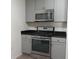 Efficient kitchen layout featuring stainless steel appliances, granite countertops, and ample storage space at 1411 Gooseneck Place # 202 Middle, Murrells Inlet, SC 29576