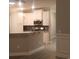 Bright eat-in kitchen featuring white cabinets, granite countertops, and stainless steel appliances at 1411 Gooseneck Place # 202 Middle, Murrells Inlet, SC 29576