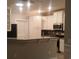 Modern kitchen with stainless steel appliances, granite countertops, and white cabinets at 1411 Gooseneck Place # 202 Middle, Murrells Inlet, SC 29576