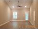 Spacious living room with neutral paint, modern ceiling fan and hardwood floors at 1411 Gooseneck Place # 202 Middle, Murrells Inlet, SC 29576