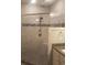 Newly renovated shower with dual shower heads, tile surround, and glass door at 1411 Gooseneck Place # 202 Middle, Murrells Inlet, SC 29576