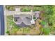 Aerial view of home with pristine landscaping, putting green, expansive driveway, and well-maintained roof at 152 Creek Harbour Circle, Murrells Inlet, SC 29576