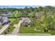 An aerial view of a single story brick home with a well manicured lawn, driveway and landscaping at 152 Creek Harbour Circle, Murrells Inlet, SC 29576