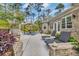 Beautiful backyard patio with lounge chairs, an umbrella, and seating at 152 Creek Harbour Circle, Murrells Inlet, SC 29576