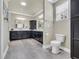 Bathroom featuring black cabinets, double sinks, a toilet, and tile floors at 152 Creek Harbour Circle, Murrells Inlet, SC 29576