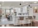 Bright kitchen with white cabinets, quartz countertops, pendant lighting, and stainless steel appliances at 152 Creek Harbour Circle, Murrells Inlet, SC 29576
