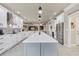 Spacious kitchen featuring white cabinets, an island, stainless steel appliances, and an open layout at 152 Creek Harbour Circle, Murrells Inlet, SC 29576