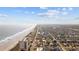 Expansive aerial view features beach, waterway, and residential area at 202 56Th Ave. N, North Myrtle Beach, SC 29582