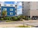 Colorful beachside condo with private balconies and lush landscaping near the ocean at 202 56Th Ave. N, North Myrtle Beach, SC 29582