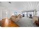 Open-concept living room features a dining area, comfortable seating, and natural light with an open floorplan at 202 56Th Ave. N, North Myrtle Beach, SC 29582