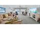 Bright living room features coastal decor, comfortable seating, and access to outdoor balcony at 202 56Th Ave. N, North Myrtle Beach, SC 29582
