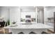 Modern kitchen with white cabinetry, stainless steel appliances, and large granite island at 227 Warner Crossing Way, Loris, SC 29569