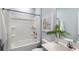 Bright bathroom features a shower-tub combination with white tiling and a modern vanity at 235 Warner Crossing Way, Loris, SC 29569