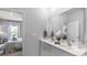 Bright bathroom with double vanity and a view into the Primary bedroom at 235 Warner Crossing Way, Loris, SC 29569