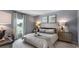 Comfortable bedroom featuring a large window with lake views and neutral decor at 235 Warner Crossing Way, Loris, SC 29569