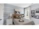 Cozy bedroom features soft, neutral tones and elegant decor at 235 Warner Crossing Way, Loris, SC 29569