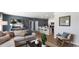 Inviting living room with couch and throw pillows open to the kitchen and dining area at 235 Warner Crossing Way, Loris, SC 29569
