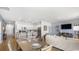 Open concept dining and living spaces flowing into the kitchen at 235 Warner Crossing Way, Loris, SC 29569