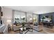 Stylish living room with large windows showcasing water view open to the dining space at 235 Warner Crossing Way, Loris, SC 29569