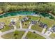 Aerial view showcasing the neighborhood with several houses, ponds, and lush greenery at 270 Moulton Dr., Longs, SC 29568