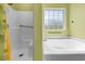 Bright bathroom featuring a separate bath and shower at 270 Moulton Dr., Longs, SC 29568