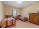 Twin beds in well-lit room with wood furniture, creating a cozy and inviting atmosphere at 270 Moulton Dr., Longs, SC 29568