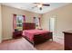 Cozy bedroom with a ceiling fan, two windows, and carpeted floors at 270 Moulton Dr., Longs, SC 29568