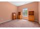 Bedroom with ample storage in wooden dressers illuminated by natural light from the window at 270 Moulton Dr., Longs, SC 29568