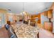 Open-concept dining room with marble table, and view into the kitchen and living room at 270 Moulton Dr., Longs, SC 29568