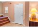 Welcoming entryway with tiled floor, carpeted stairs, and warm lighting, creating a cozy transition space at 270 Moulton Dr., Longs, SC 29568