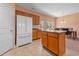 Kitchen area with a center island, refrigerator, and view of the breakfast nook at 270 Moulton Dr., Longs, SC 29568