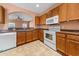 Kitchen featuring an oven, dishwasher, and wooden cabinets at 270 Moulton Dr., Longs, SC 29568