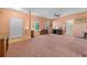 Sunlit living room featuring neutral walls, tile entryway, and stylish furnishings, with a view of stained glass window at 270 Moulton Dr., Longs, SC 29568