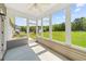 Covered screened porch offering views of the well manicured lawn and detached shed at 270 Moulton Dr., Longs, SC 29568