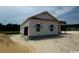 Exterior of a new two-car garage featuring unfinished siding and double windows at 334 William Nobles Rd., Aynor, SC 29511