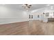 Bright and spacious living area featuring open floor plan, vaulted ceiling, and wood-look floors at 334 William Nobles Rd., Aynor, SC 29511