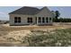 New construction of a modern farmhouse with white siding and black windows at 346 Ridge Rd., Galivants Ferry, SC 29544