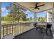 Relaxing balcony with a table and chairs overlooking a lush golf course at 4771 Wild Iris Dr. # 204, Myrtle Beach, SC 29577