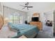 Spacious bedroom with a large window, desk, and comfortable bed at 4771 Wild Iris Dr. # 204, Myrtle Beach, SC 29577