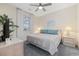 Cozy bedroom with a large window and comfortable bed at 4771 Wild Iris Dr. # 204, Myrtle Beach, SC 29577