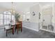 Dining room with wooden table and carpet, and large windows at 4771 Wild Iris Dr. # 204, Myrtle Beach, SC 29577