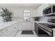 Well-equipped kitchen with white cabinets and stainless steel appliances at 4771 Wild Iris Dr. # 204, Myrtle Beach, SC 29577
