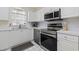 Modern kitchen with stainless steel appliances and white cabinetry at 4771 Wild Iris Dr. # 204, Myrtle Beach, SC 29577