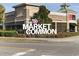 Charming brick building with the Market Common sign in front of manicured landscaping at 4771 Wild Iris Dr. # 204, Myrtle Beach, SC 29577
