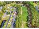 Aerial view showcases the community's proximity to the golf course, pond, and winding roads at 4738 Southern Trail, Myrtle Beach, SC 29579